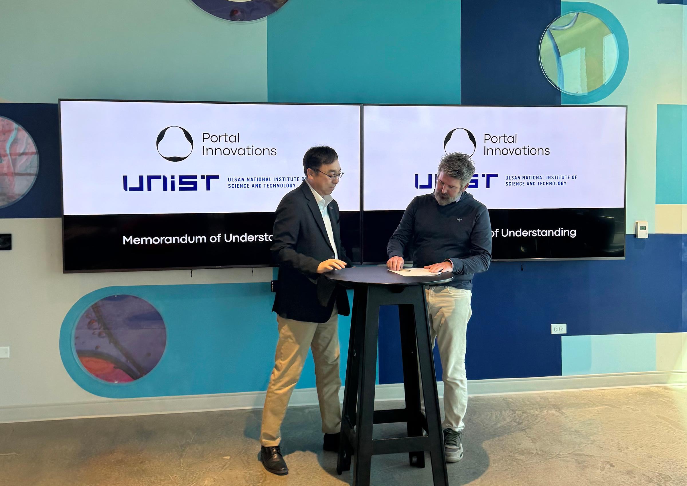 Vice President Sung Chul Bae (left) at the May 2026 MOU signing with Portal Innovations.
