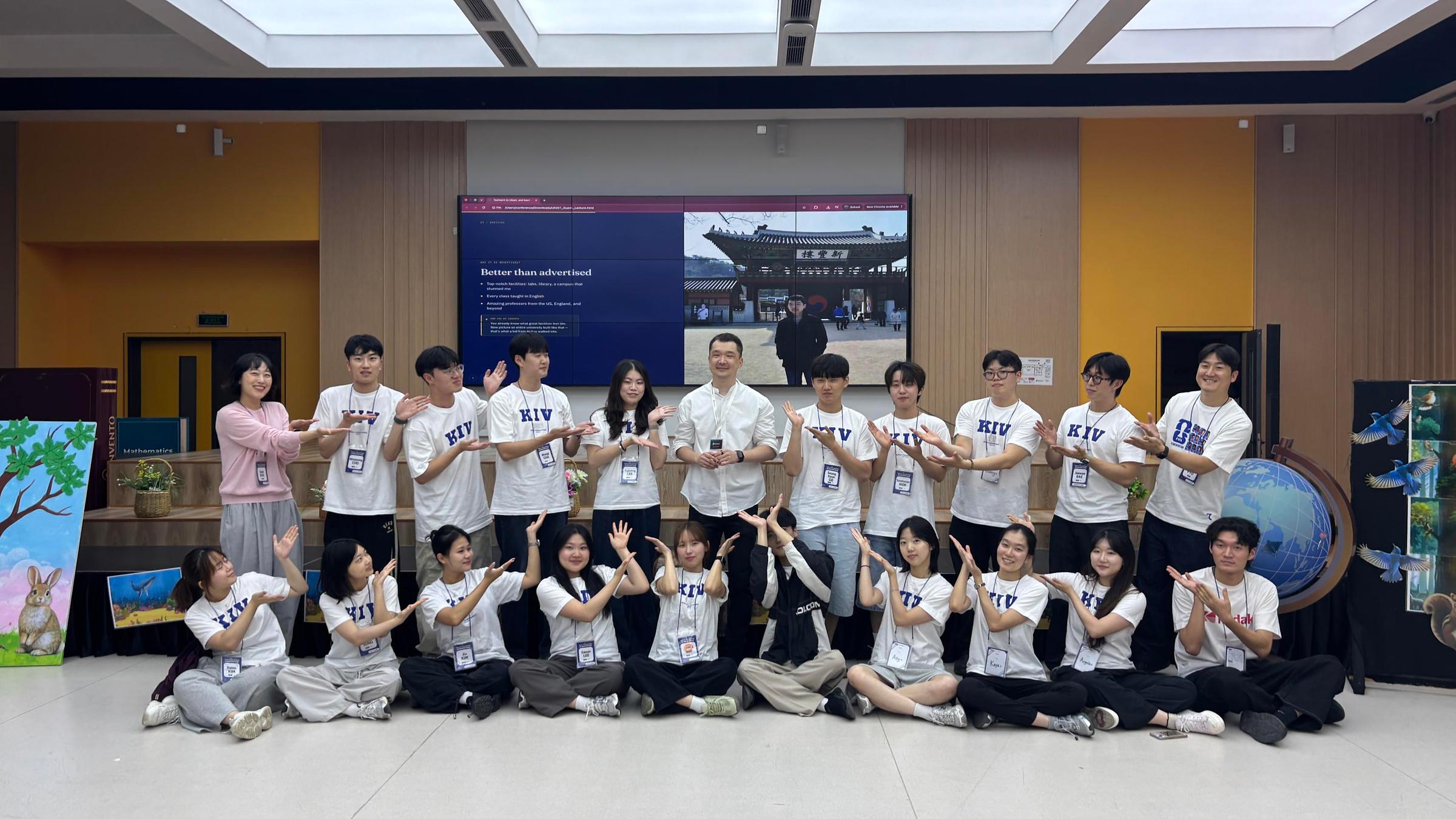 UNIST alumnus Arzubek Murtazaev (center) with student volunteers following a talk on his academic and research experiences in Korea.